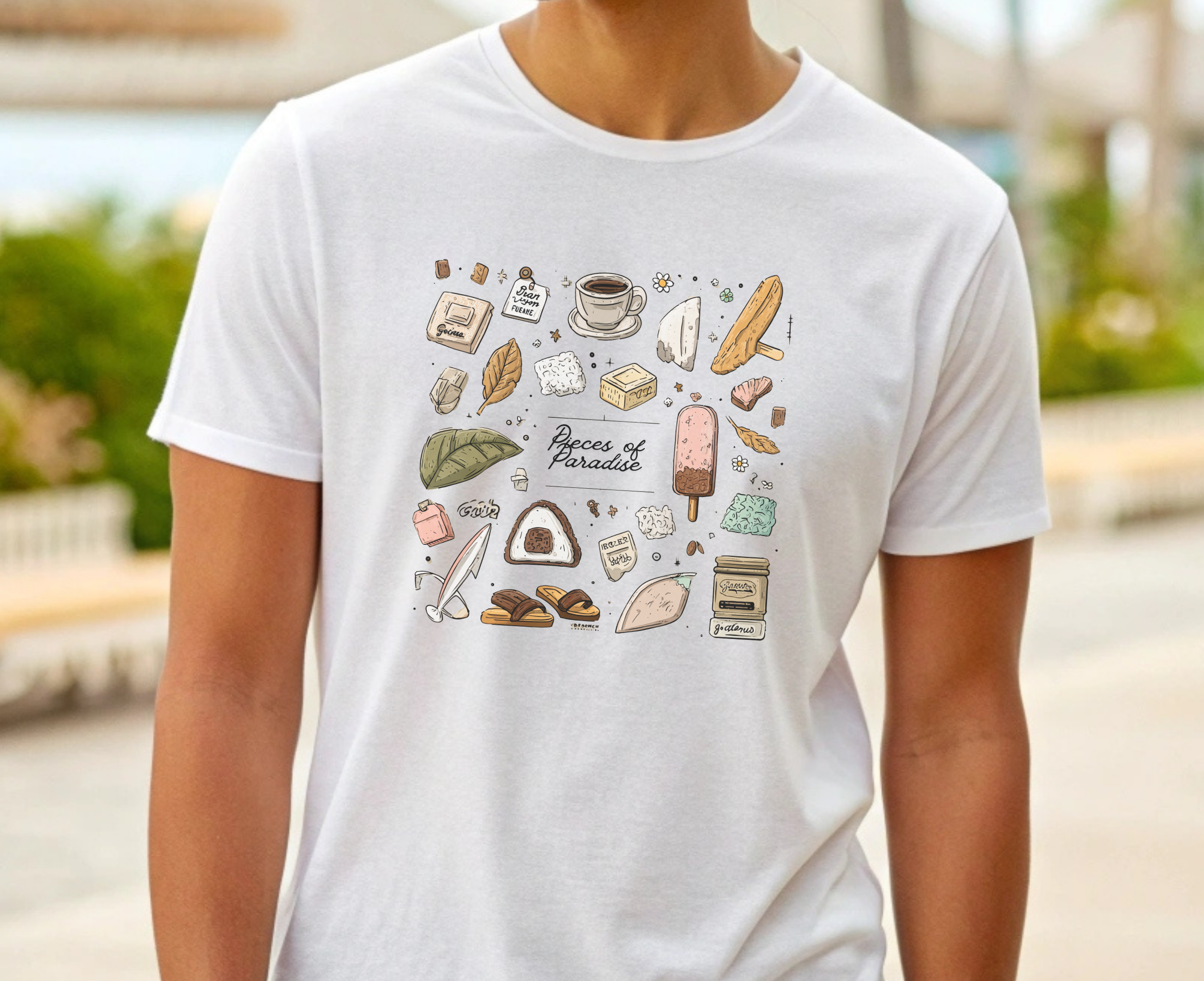 White t-shirt with colorful graphic design of food items worn by a person outdoors.