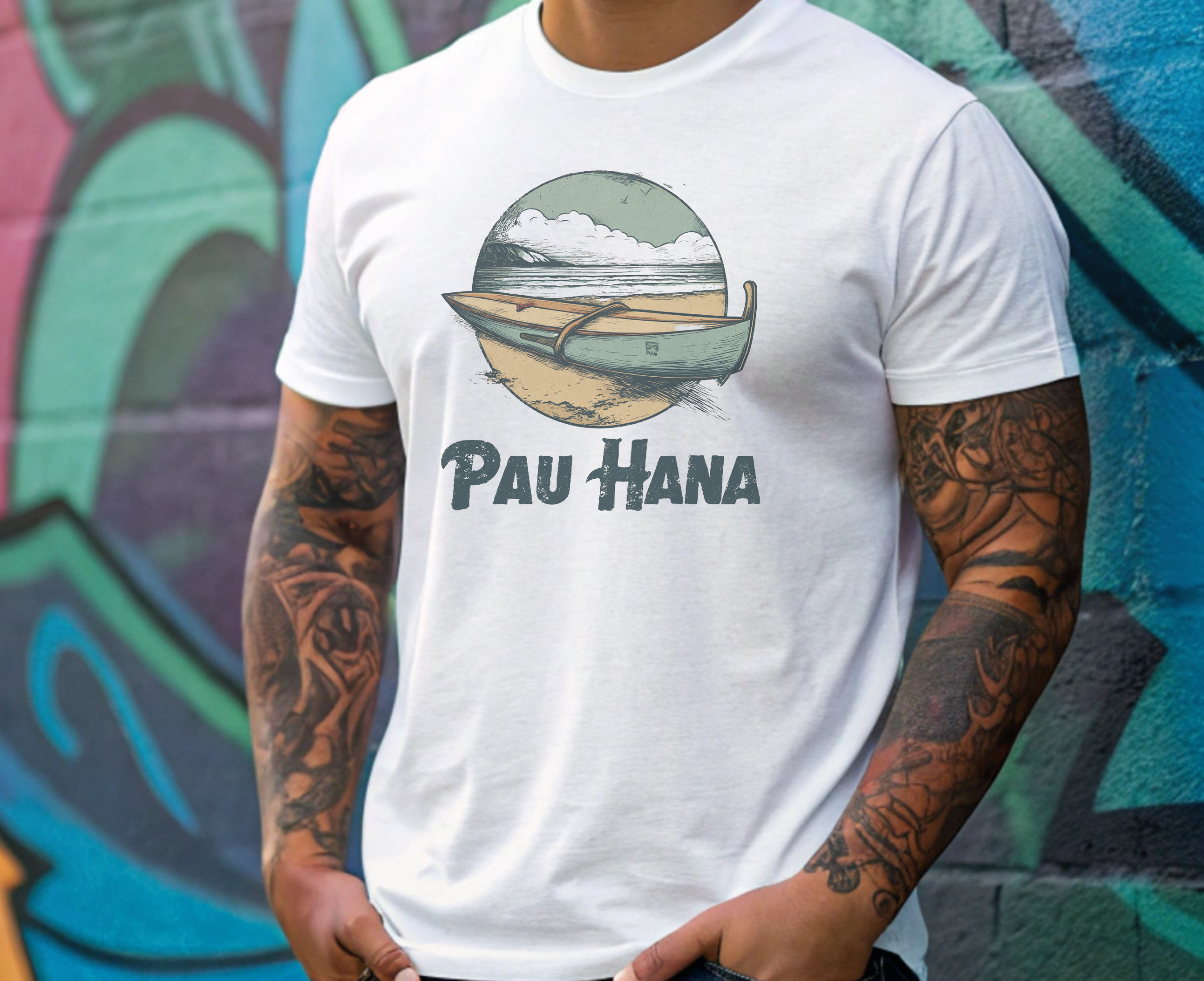 Person wearing a white t-shirt with a graphic design and text in front of a colorful mural.