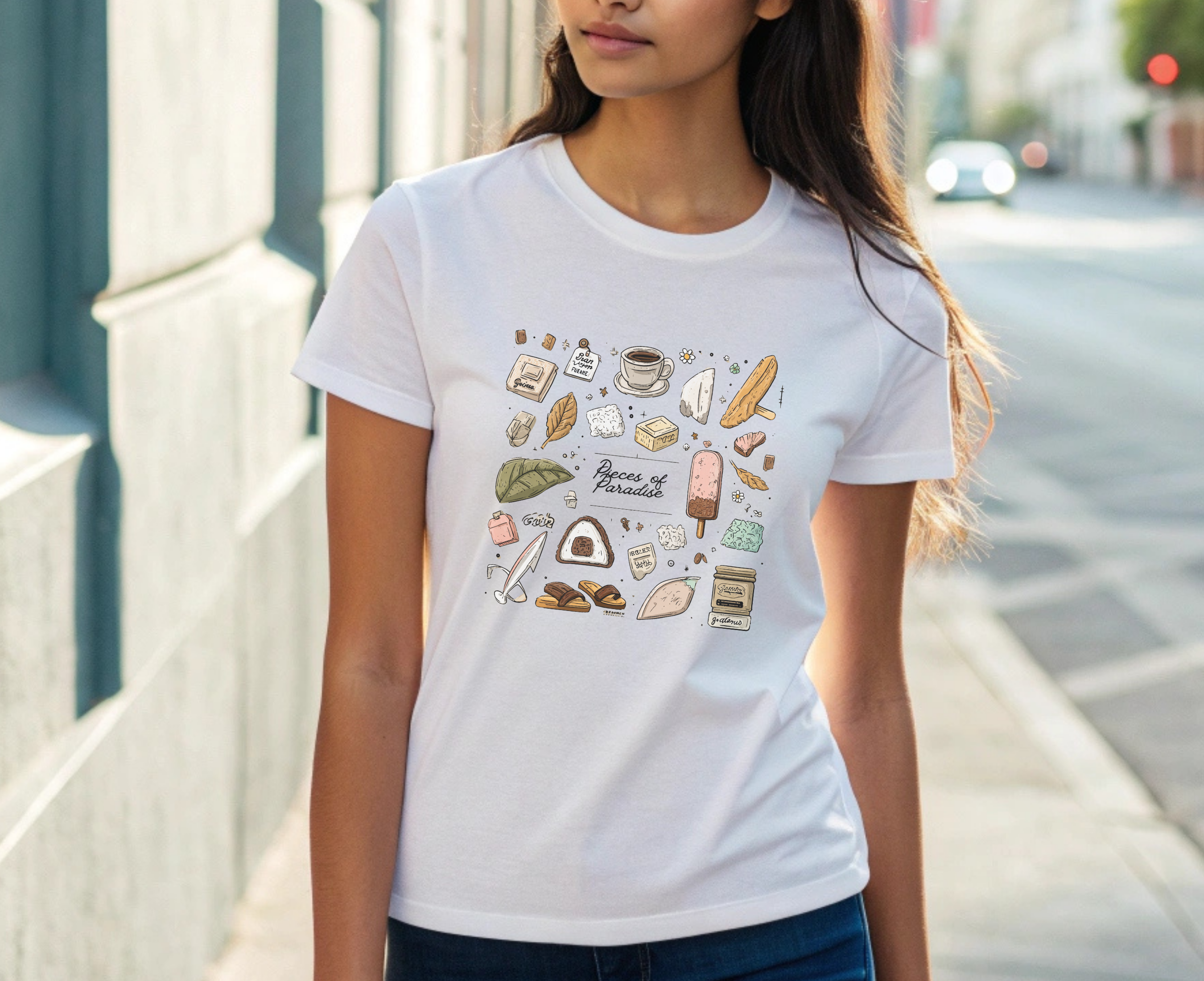 Person wearing a white t-shirt with colorful graphics and text on a city street.