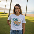 White t-shirt with tropical graphic design featuring palm trees and the word 'Aloha' on a white background.