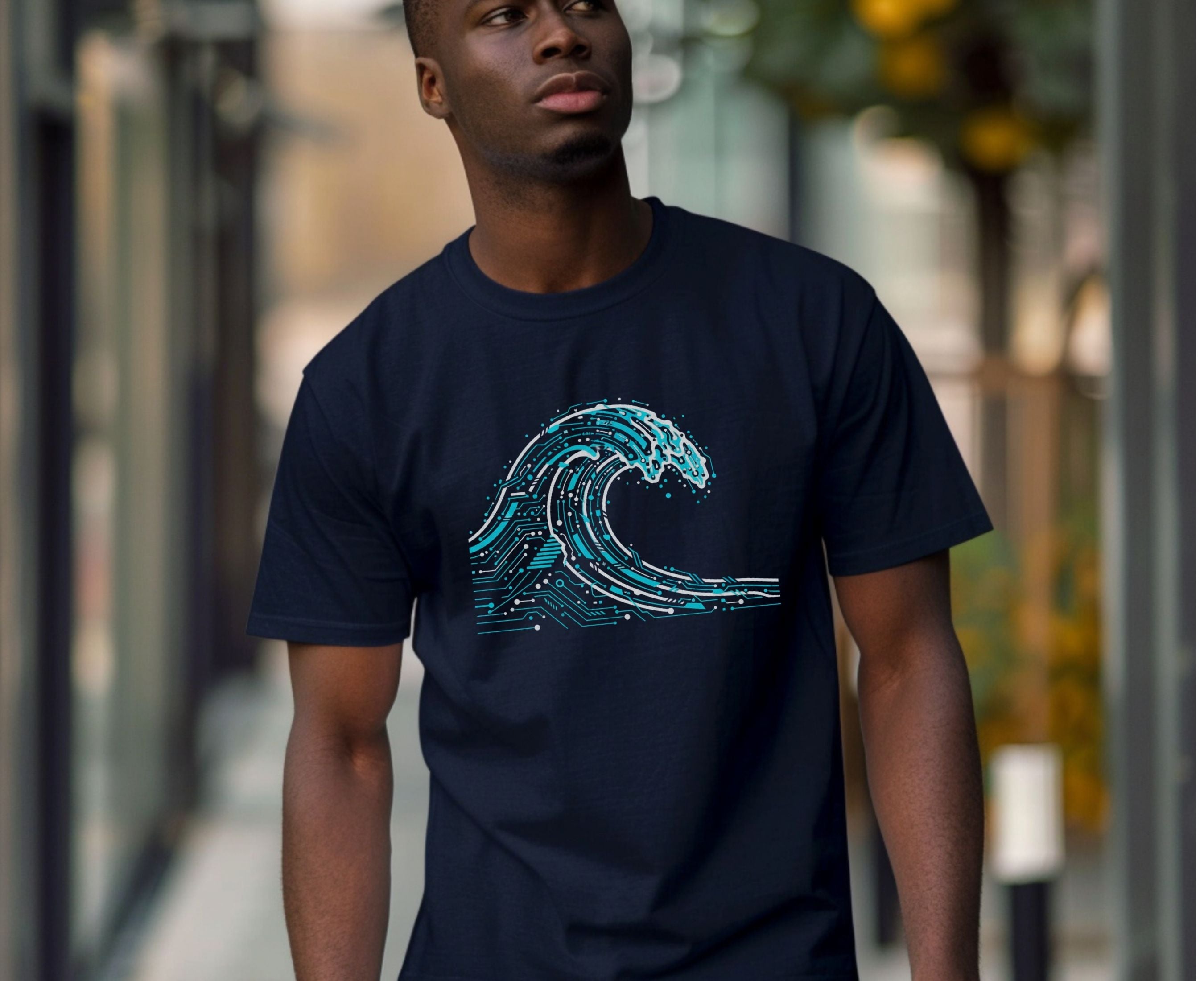 Man wearing a navy blue t-shirt with a wave design outdoors