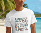 Person wearing a white t-shirt with 'Pieces of Paradise' graphic design, beach background